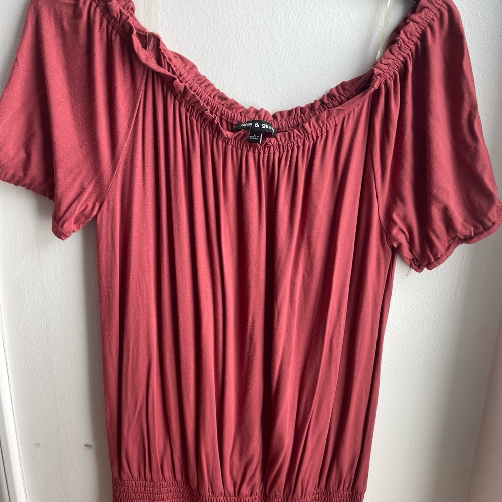 Cable and gauge. Large burnt auburn orange. Off the shoulder or scoop neck.